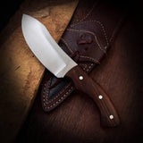 TimberStrike Survival Knife in a leather sheath for outdoor adventures