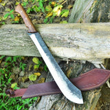 Custom handmade high carbon steel camping knife with leather sheath.
