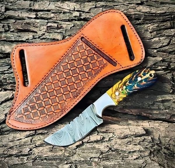 Custom handmade belt knife with a 7.5-inch Damascus steel blade and epoxy pine-cone resin handle.