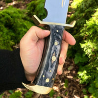 Exotic wood handle with brass guard on the best Bowie knife.