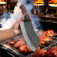 High-carbon steel blade of the Meat Cutter Knife cutting through raw meat.
