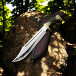 Custom handmade Crocodile Dundee knife with 13-inch D2 steel blade and leather sheath.