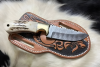 Handmade cowboy knife with Damascus steel blade and antler horn handle
