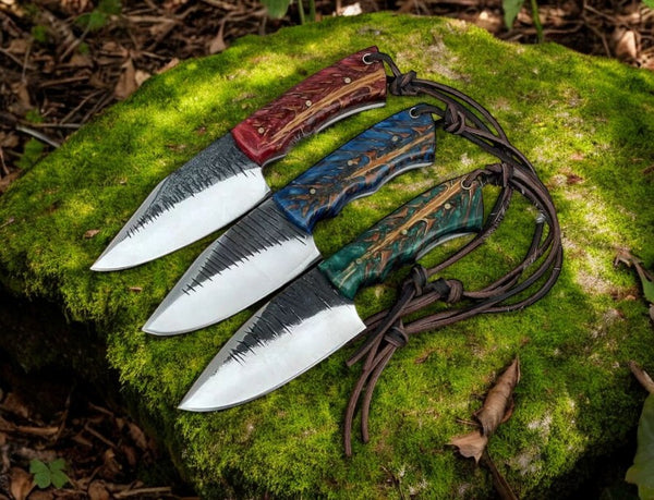 Custom fixed blade knife with high-carbon steel blade and epoxy pine-cone handle.
