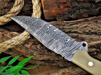 Razor-sharp Damascus skinning knife with bone handle, 8.25-inch blade, and leather sheath.