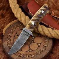 Custom Handmade Damascus skinning knife with sheep horn handle and Damascus guard, 7.75-inch.
