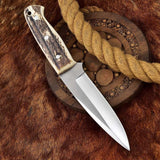 Deer skinning knife featuring full tang D2 steel construction and antler horn handle.
