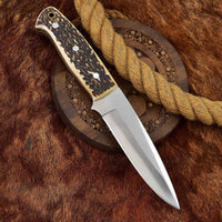 High-quality skinning blade with a Rockwell Hardness of 55-58 HRC and leather sheath.
