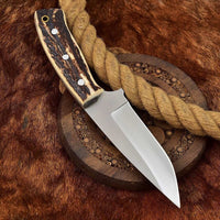 The Premier Deer Skinning Blade, featuring a custom handmade D2 steel blade and antler horn handle.