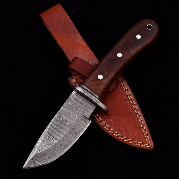 Custom Damascus steel skinning blade, 7.75-inch length with walnut wood handle, perfect for precision skinning.