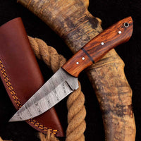 Good skinning knife with Damascus steel blade and rosewood handle, Rockwell Hardness 55-58 HRC.
