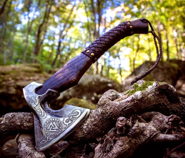 Close-up of the hand-engraved steel blade on the Native American tomahawk
