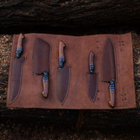 Custom Handmade Kitchen Knives Set with forged Damascus steel blades, Rosewood, Buffalo horn handles, Pakka wood spacers, and leather roll. Perfect for precision cutting in the kitchen.