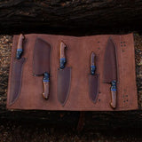 Custom Handmade Kitchen Knives Set with forged Damascus steel blades, Rosewood, Buffalo horn handles, Pakka wood spacers, and leather roll. Perfect for precision cutting in the kitchen.