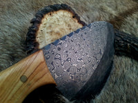 Close-up of the 4-inch raindrops Damascus steel blade showcasing its unique pattern.
