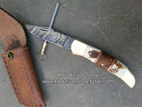 Rosewood, antler horn, and brass bolster handle of The Dual Edge knife
