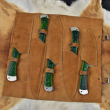 Leather roll containing a complete kitchen knife set for chefs