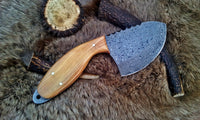 Raindrops Damascus steel gut hook skinning knife featuring an olive wood handle and 4-inch blade.
