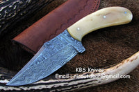 Custom handmade Alaskan skinning knife featuring a 4.25-inch Damascus steel blade and bone handle.