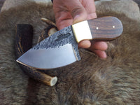 Rosewood handle with brass bolster on a custom deer skinning knife.
